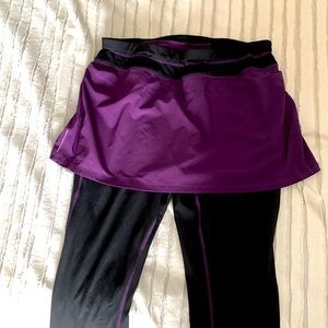 Athleta black leggings with purple connected skirt. Size large